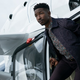 Mamoudou Athie getting off a helicopter